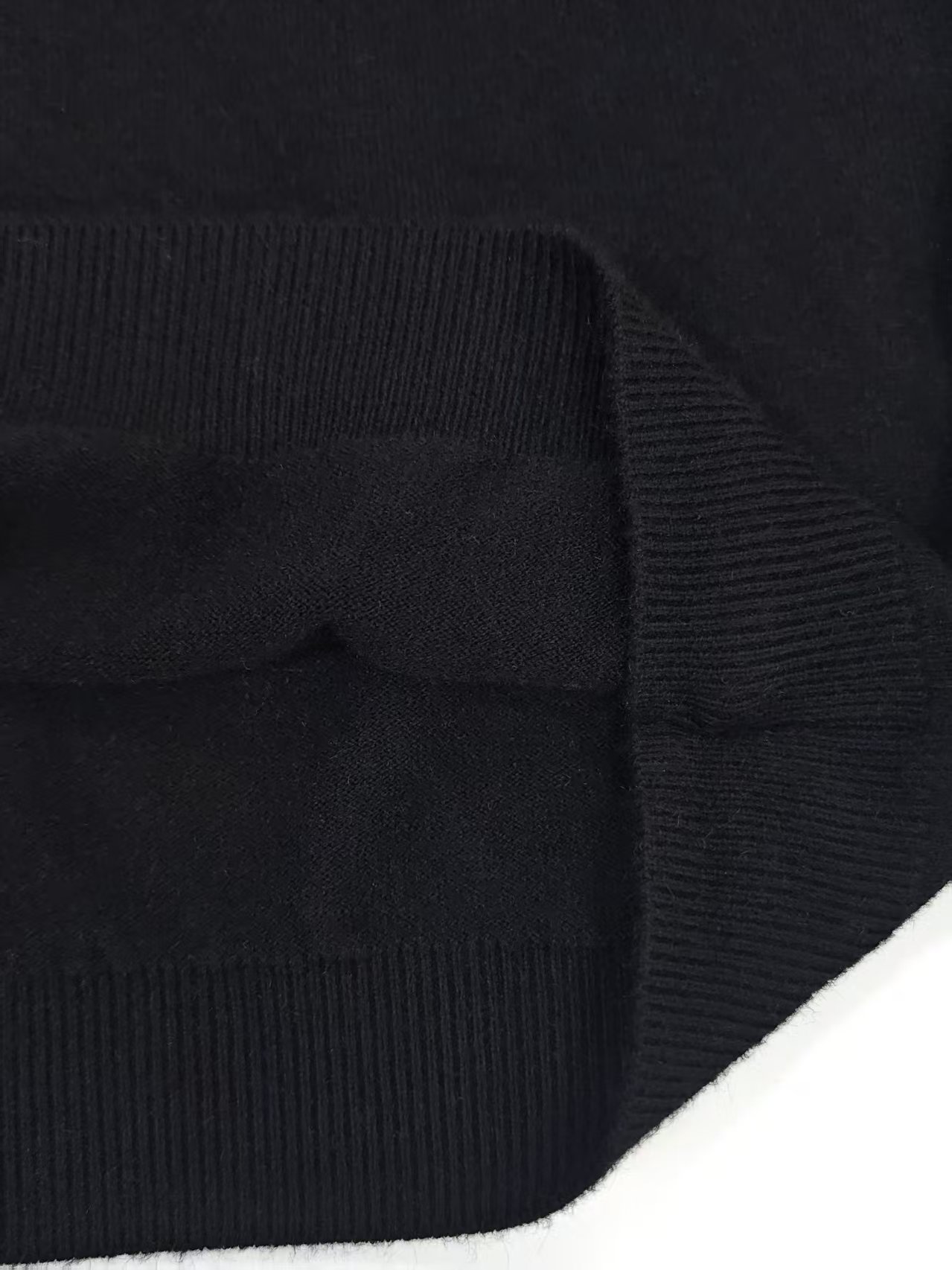 Side view and cuff detail of men's crewneck sweater TF8327