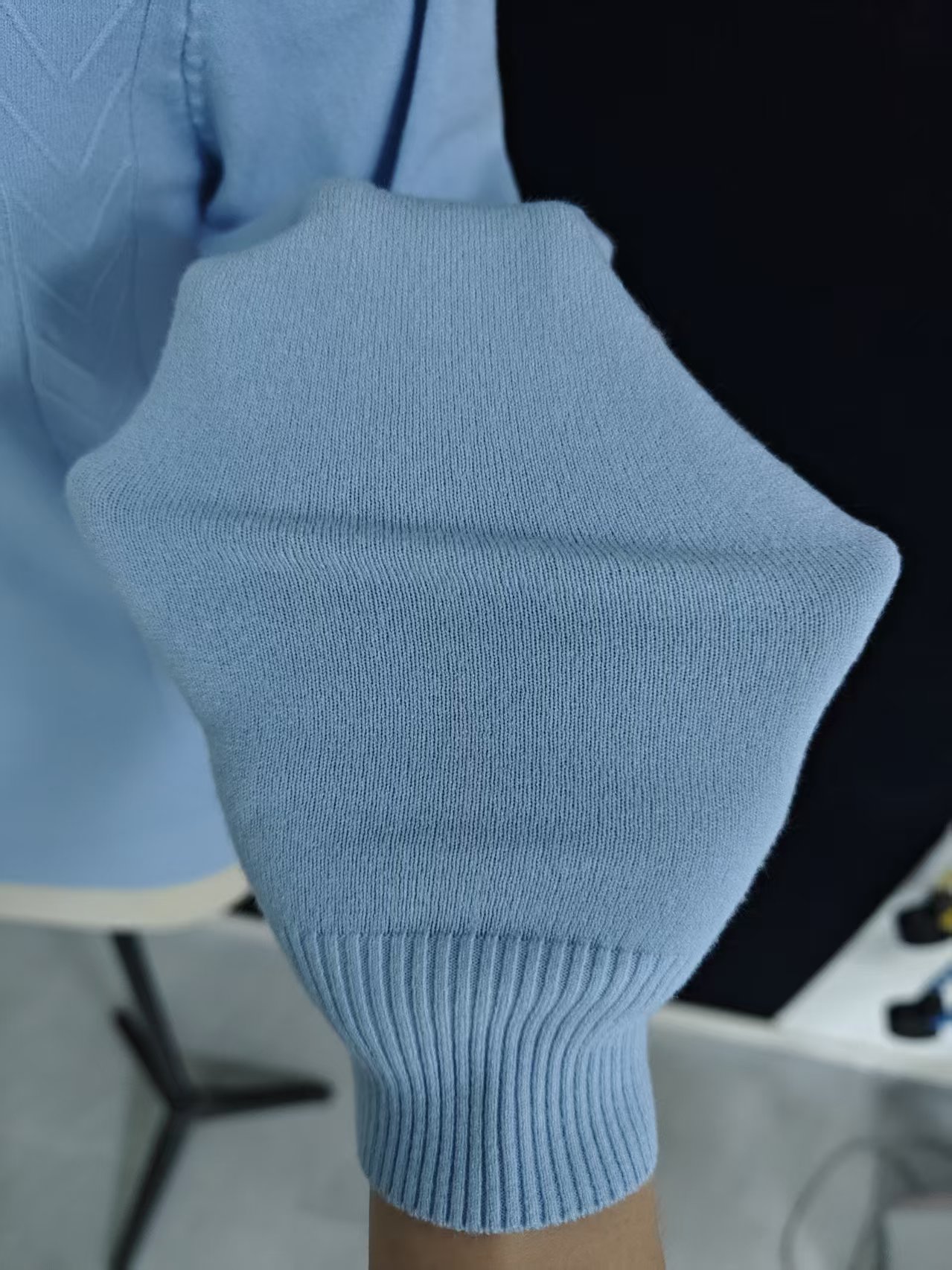 Close up of ribbed collar and knit fabric on ladies' sweater TF8550