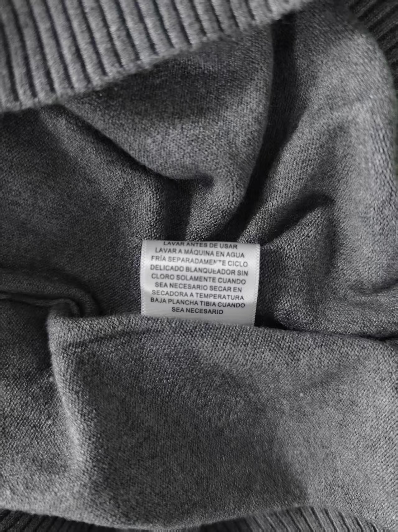 Inner seam and ribbed hem detail of ladies' sweater TF8663