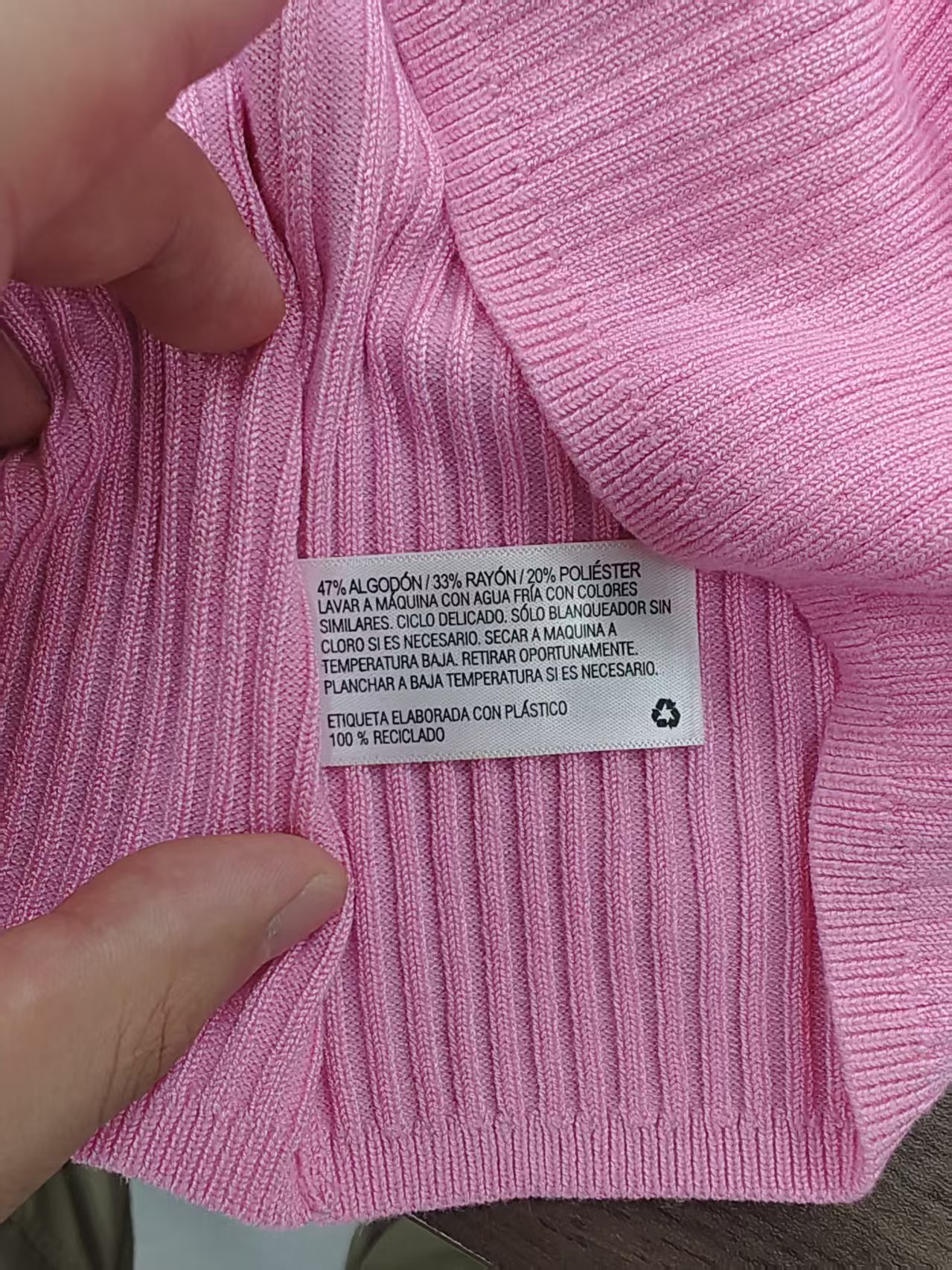 Garment care tag and material composition label on sweater TF8828