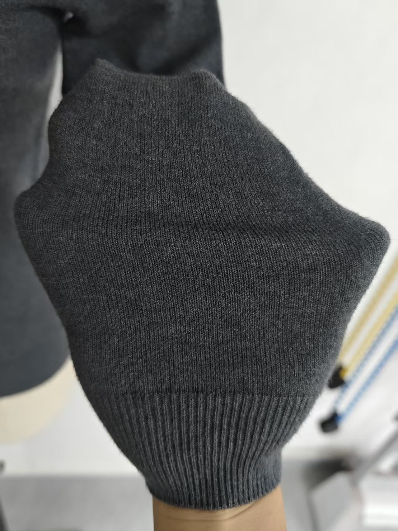 Close-up detail of soft cotton knit fabric and crew neck collar