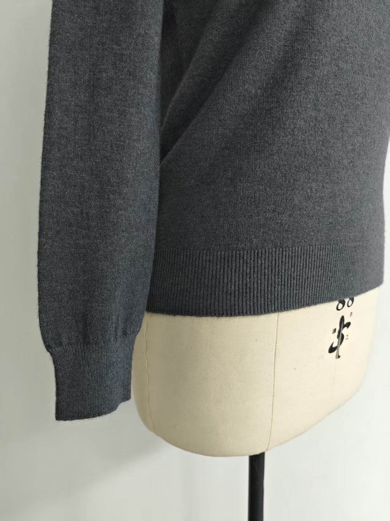 Side view of women's casual crew neck fitted knit sweater