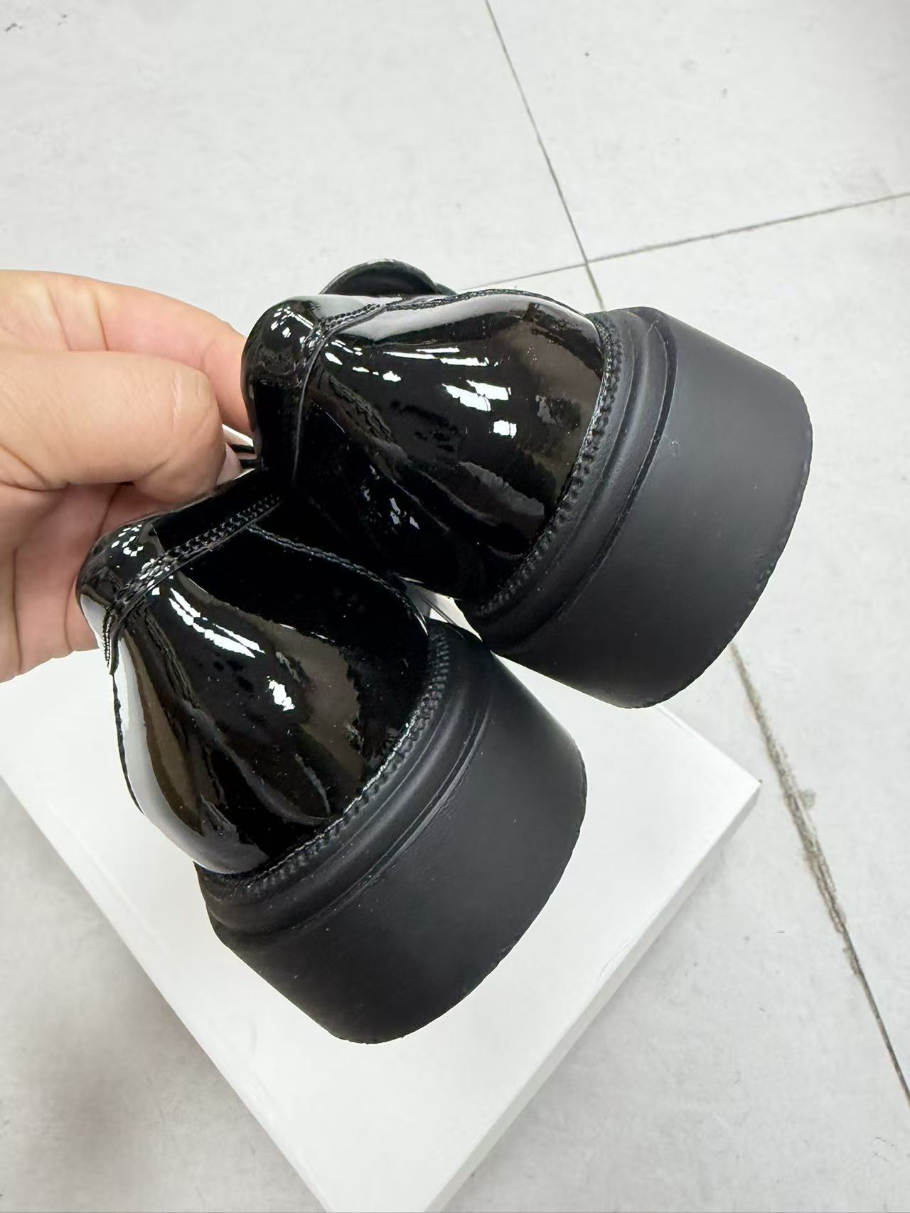 Close-up detail of soft leather upper on black women's shoes