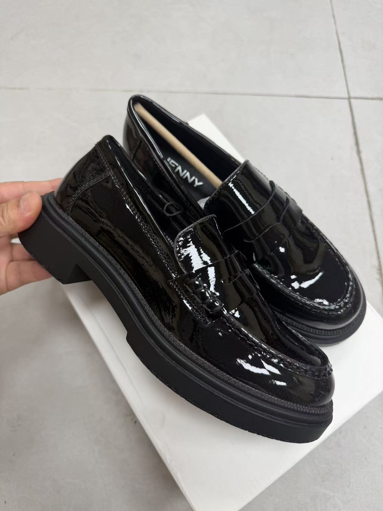 Side view of women's black low heel casual dress shoes