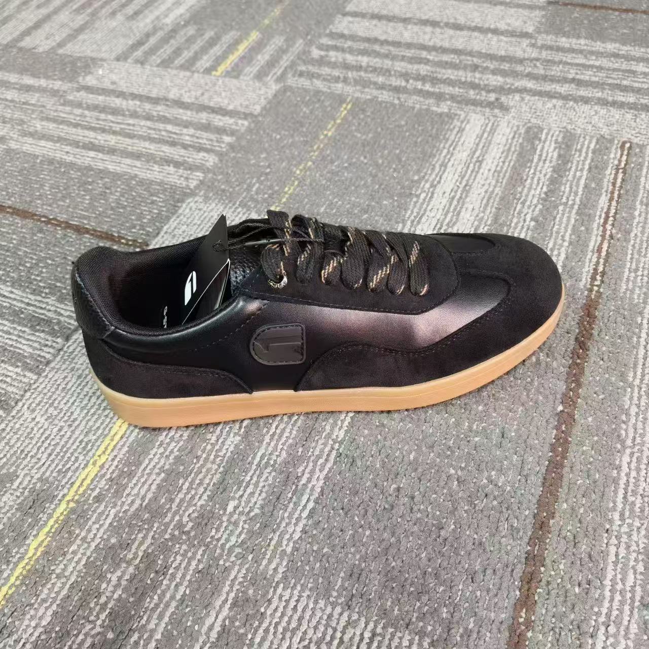 Side view of women's black casual slip-on flat shoes