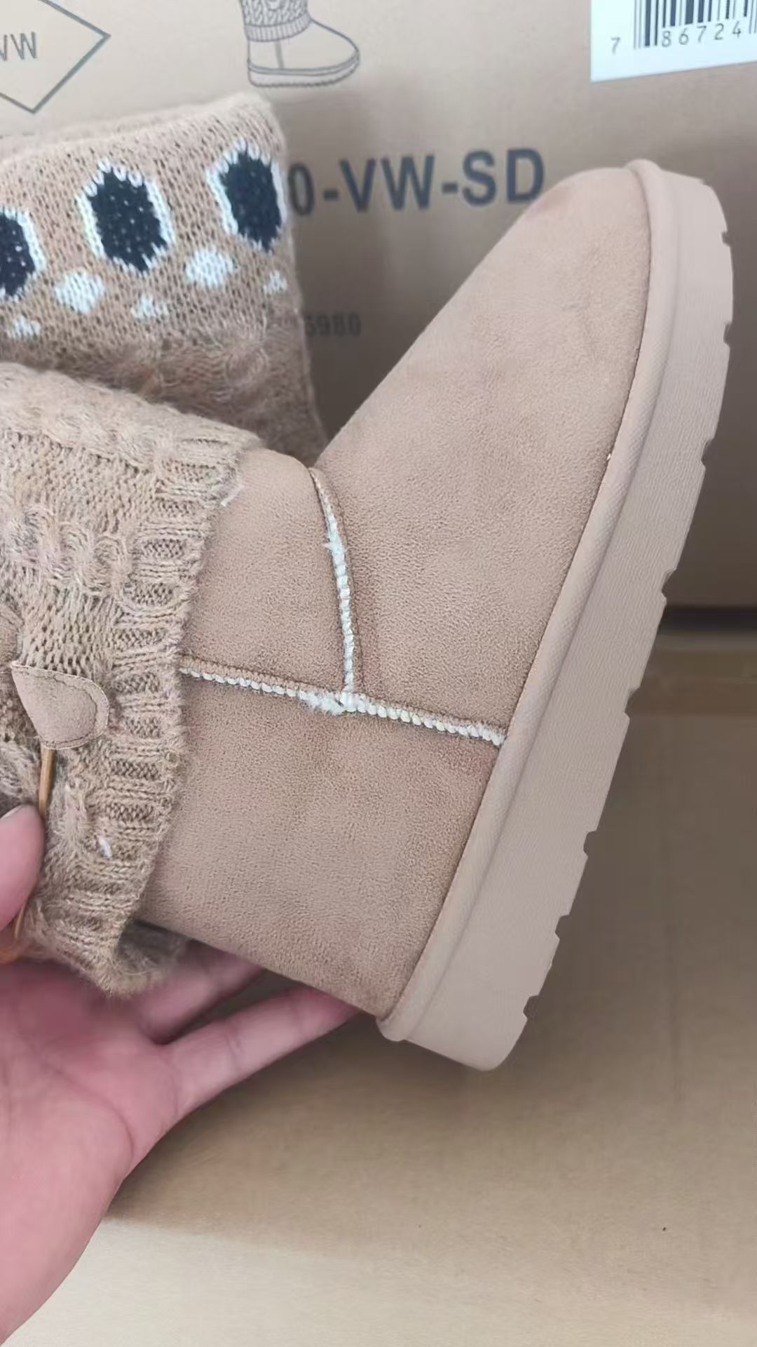 Pair of pink plush-lined women's winter boots wholesale