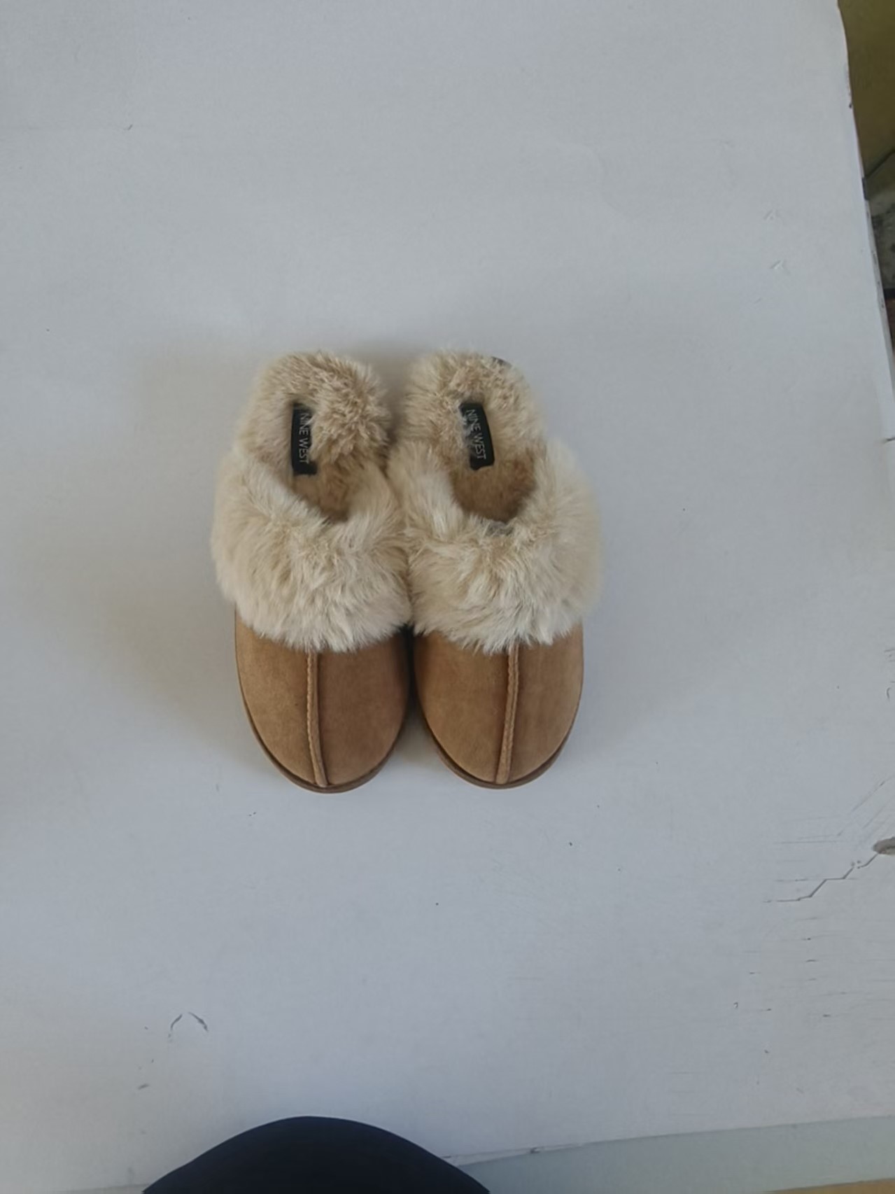Pair of women's sand color plush indoor outdoor slippers