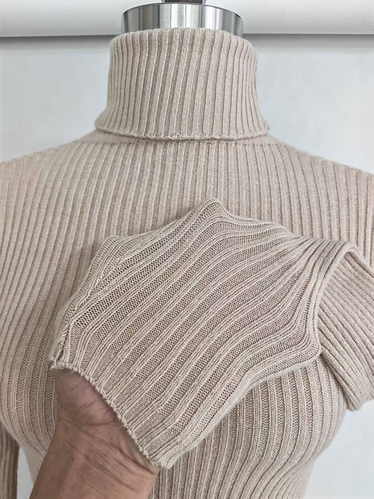 Close-up detail of mock neck collar and soft cotton knit fabric