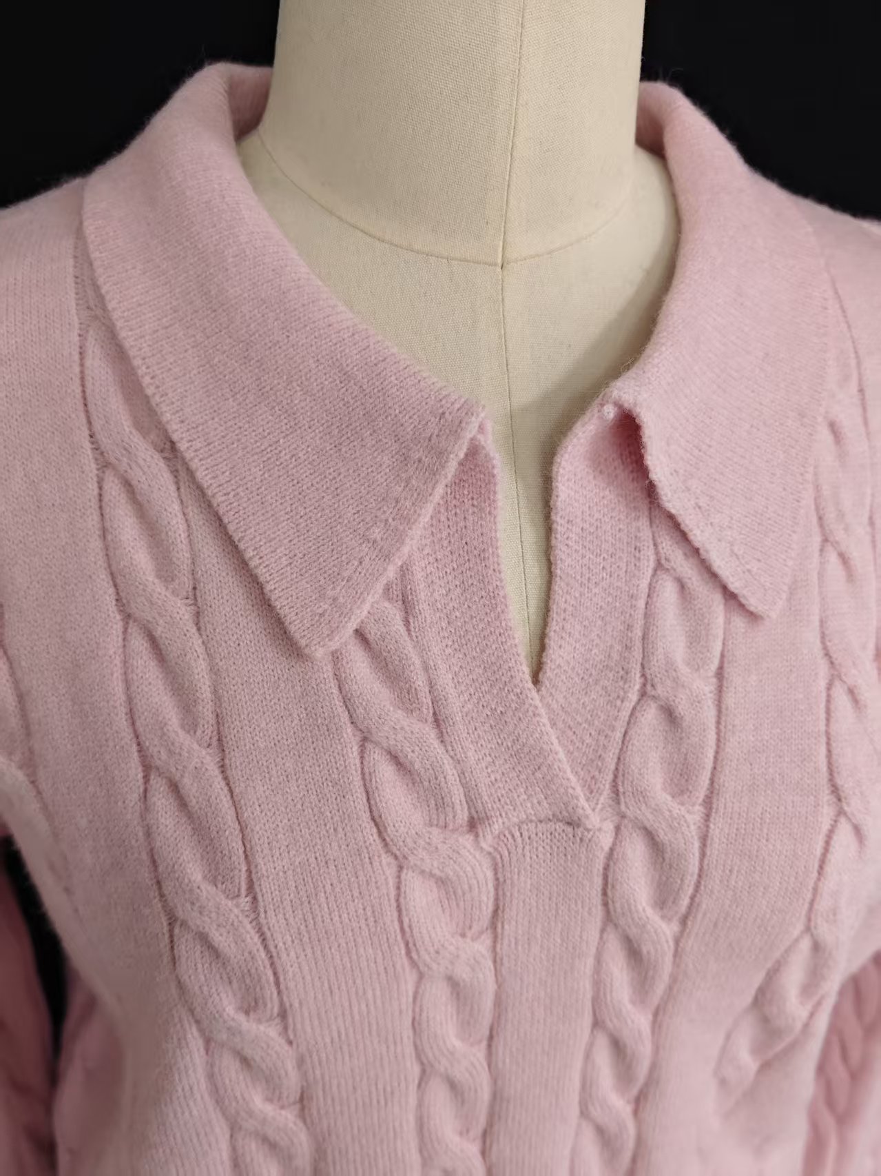 Detail view of v-neck polo collar on ladies' knit sweater