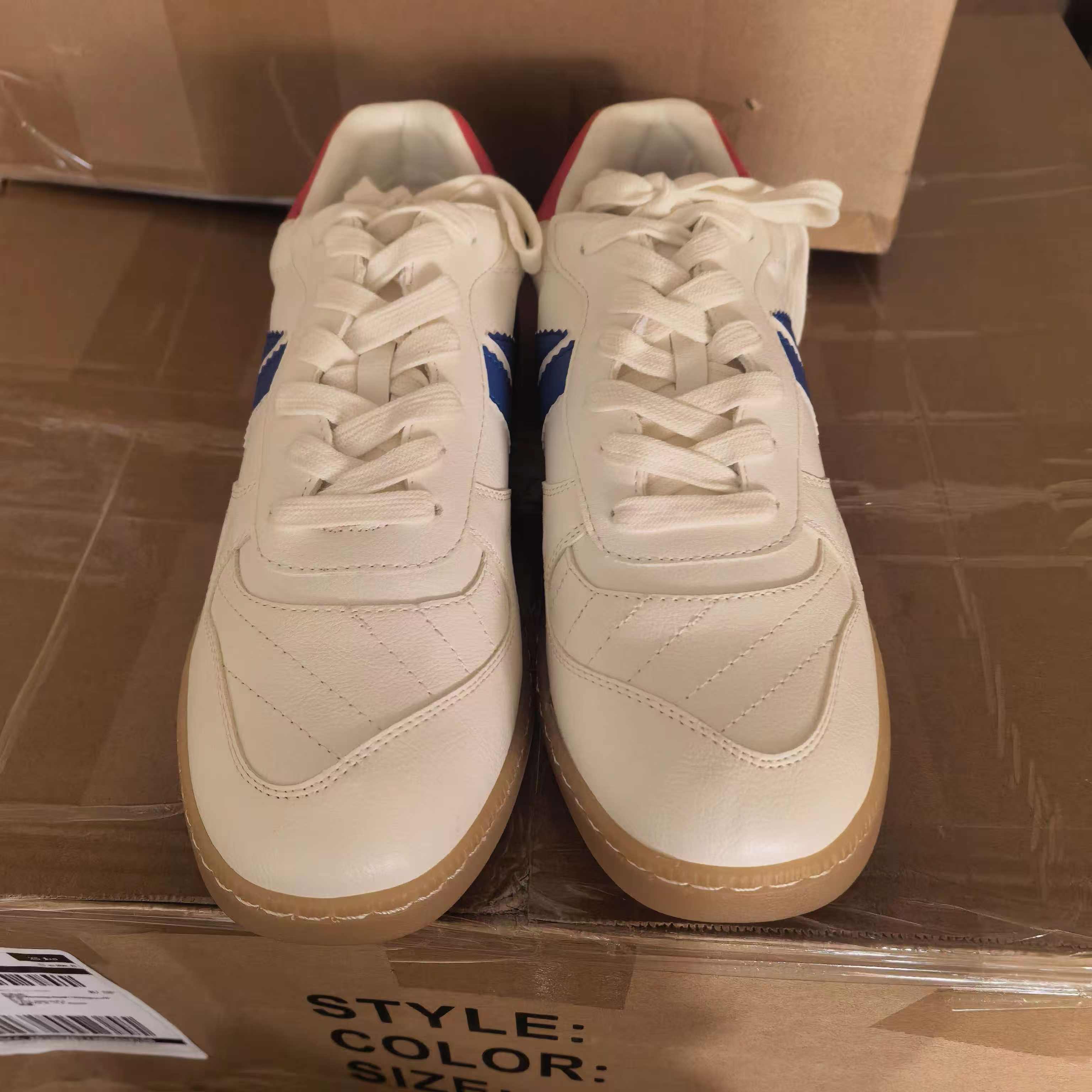 Front view of women's brown and white casual shoes TF9147