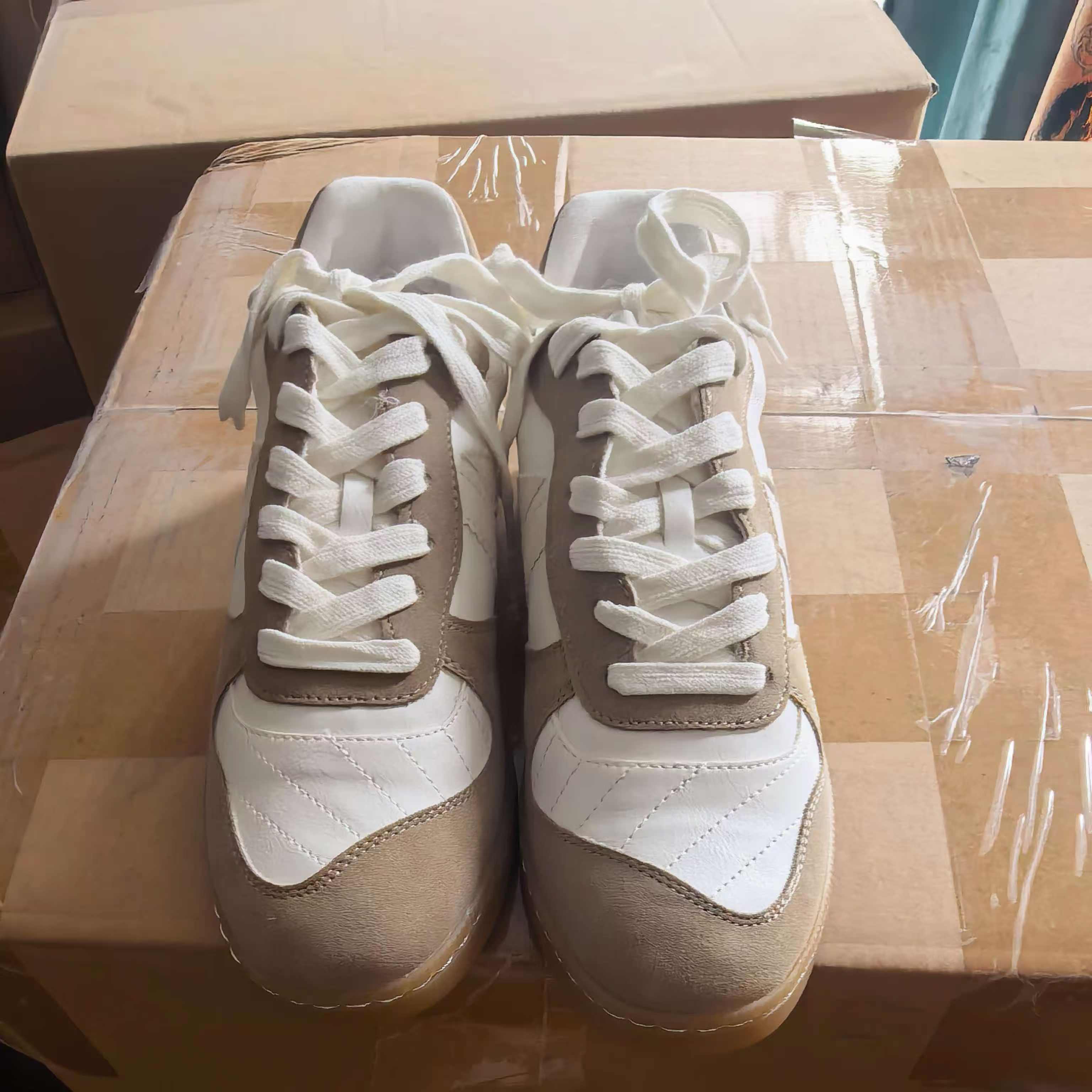 Pair of ladies' black and white casual leather sneakers