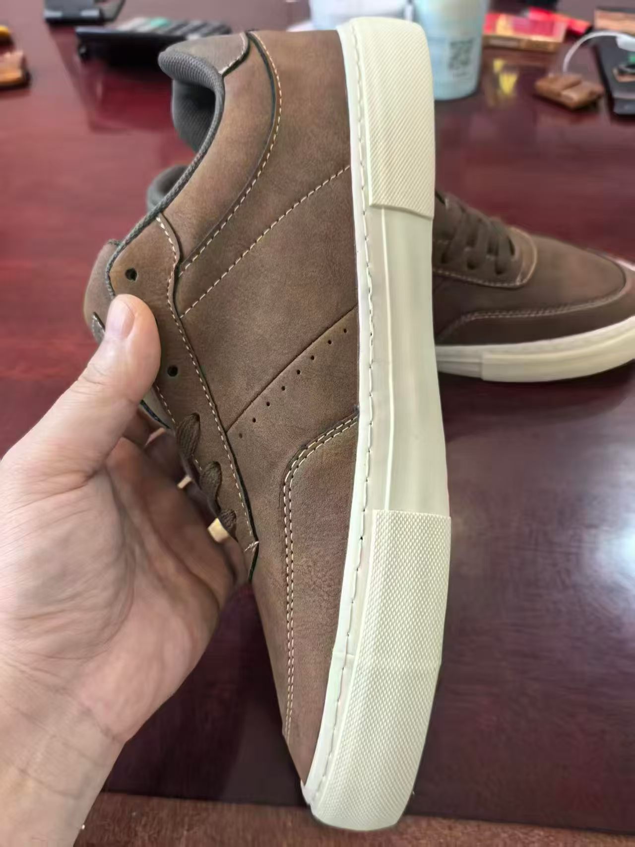 Side view of men's brown leather fashion sneakers TF9516
