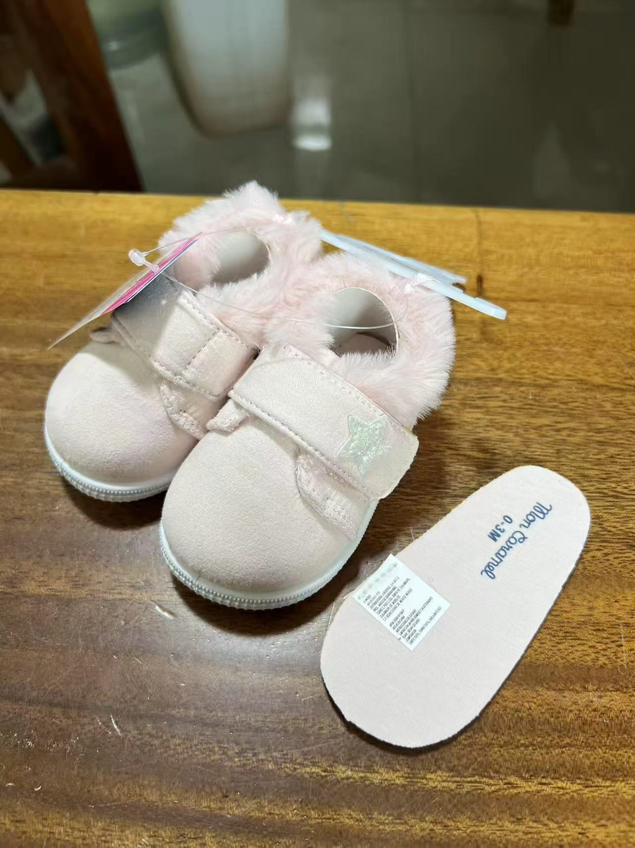 Bottom view of baby pink cozy booties with anti-slip sole