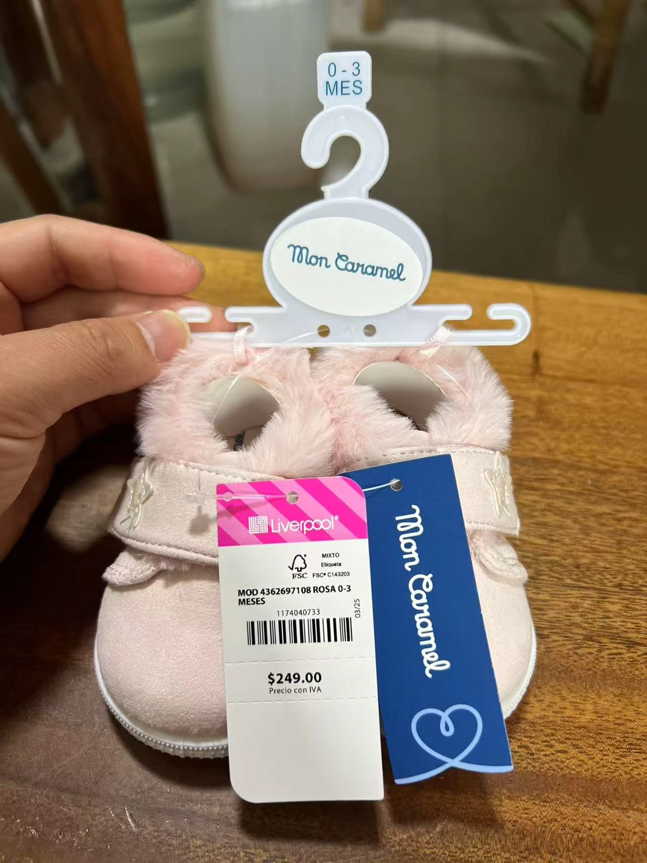 Detail view of baby pink shoes TF9239 with brand tags
