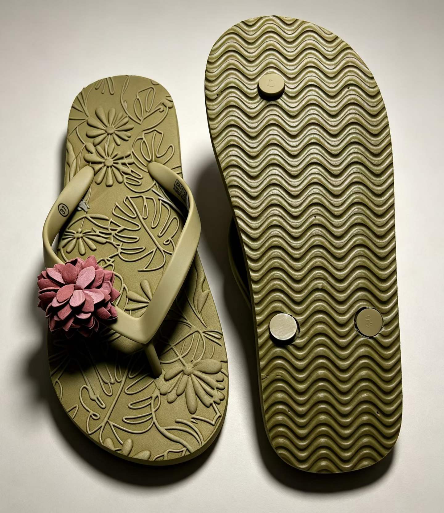 Bottom and heel view of women's olive slippers wholesale