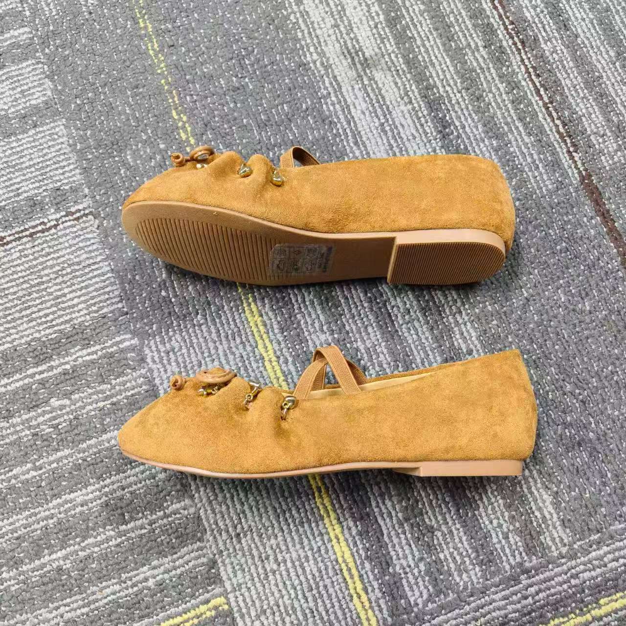 Pair of kid's tan suede fringe slip-on shoes TF9515