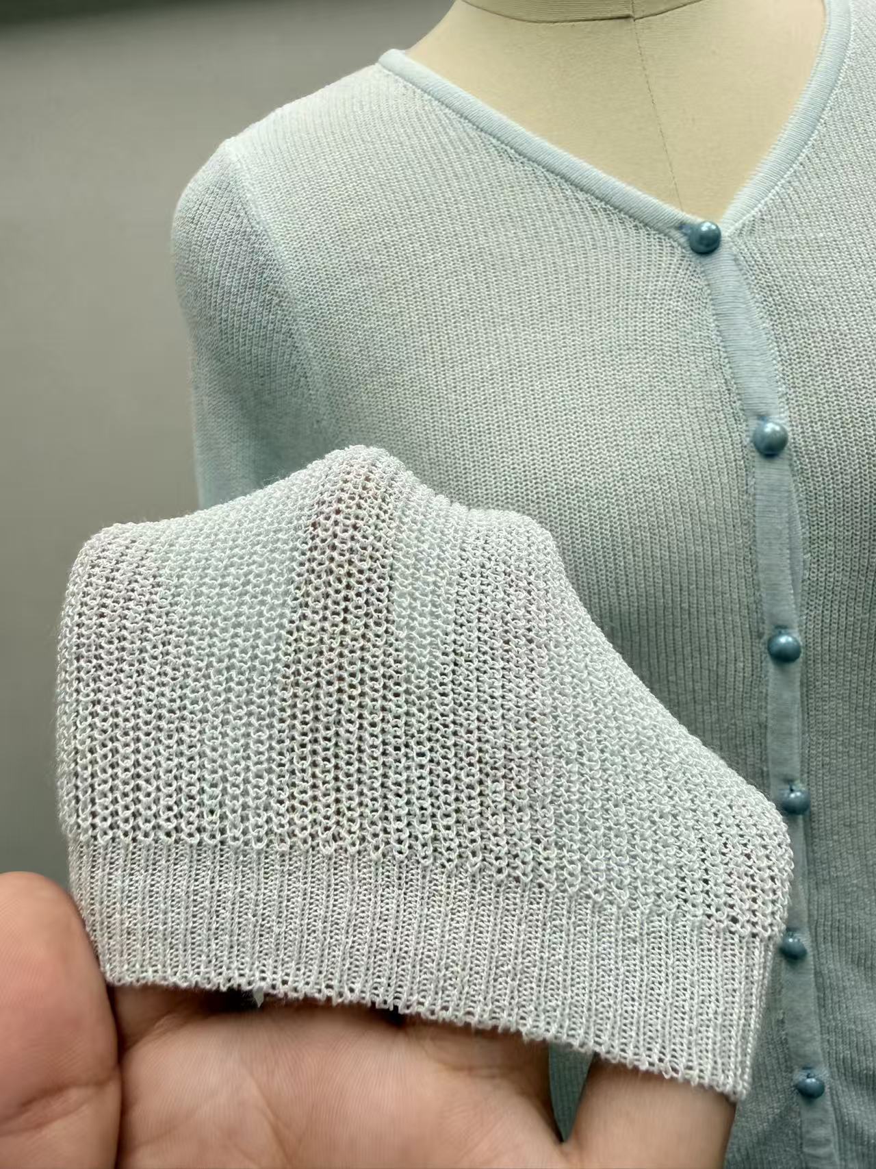 Front view of women's blue long sleeve button-up cardigan