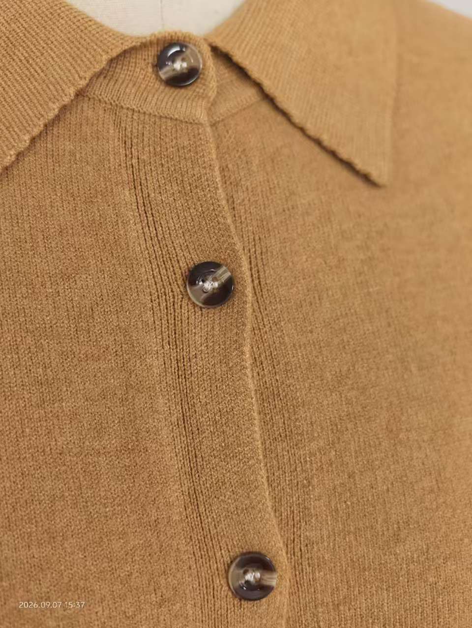 Close-up of ribbed collar and soft cotton knit fabric texture