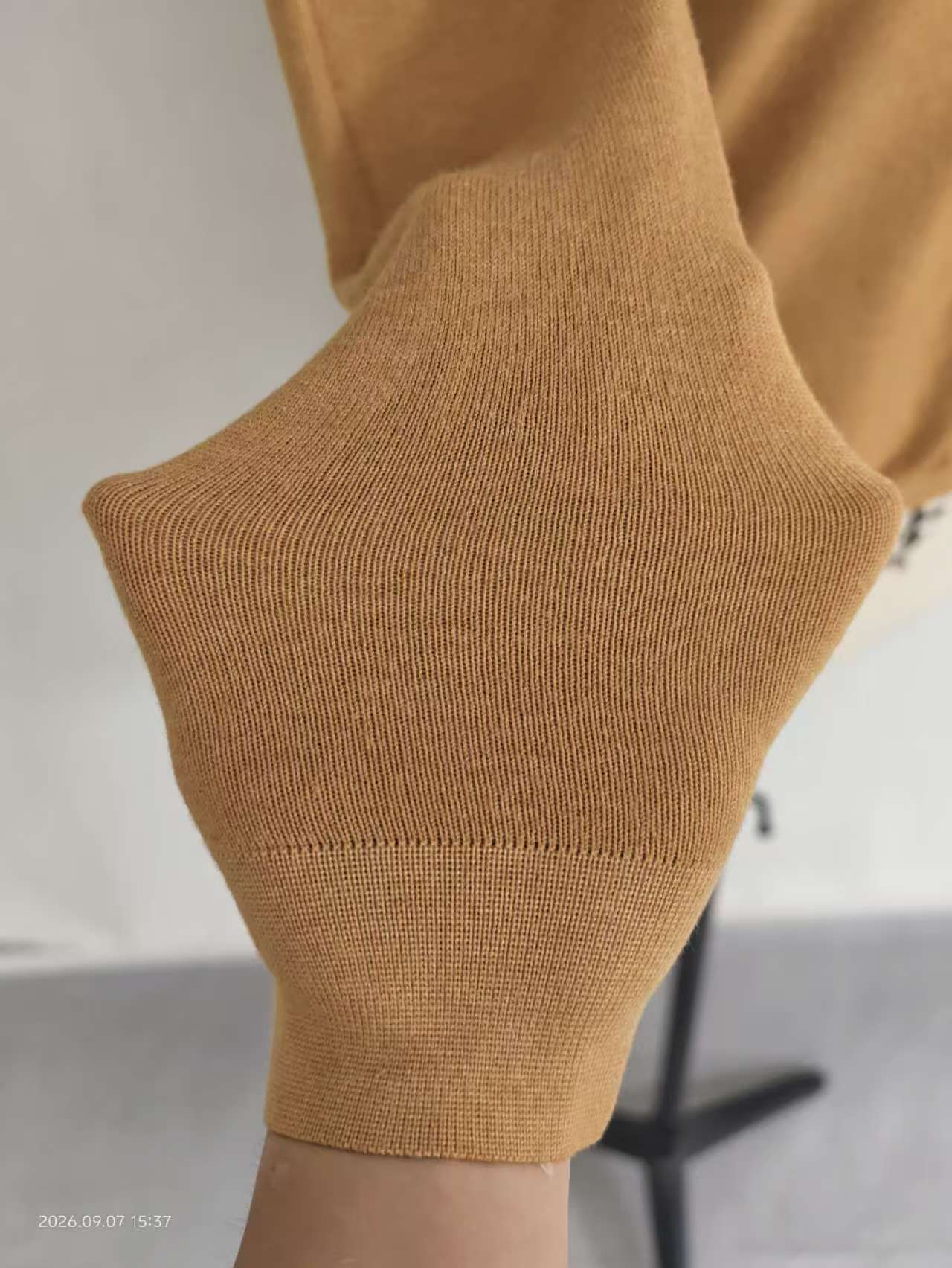 Close-up detail of knit fabric texture and shoulder line TF9464