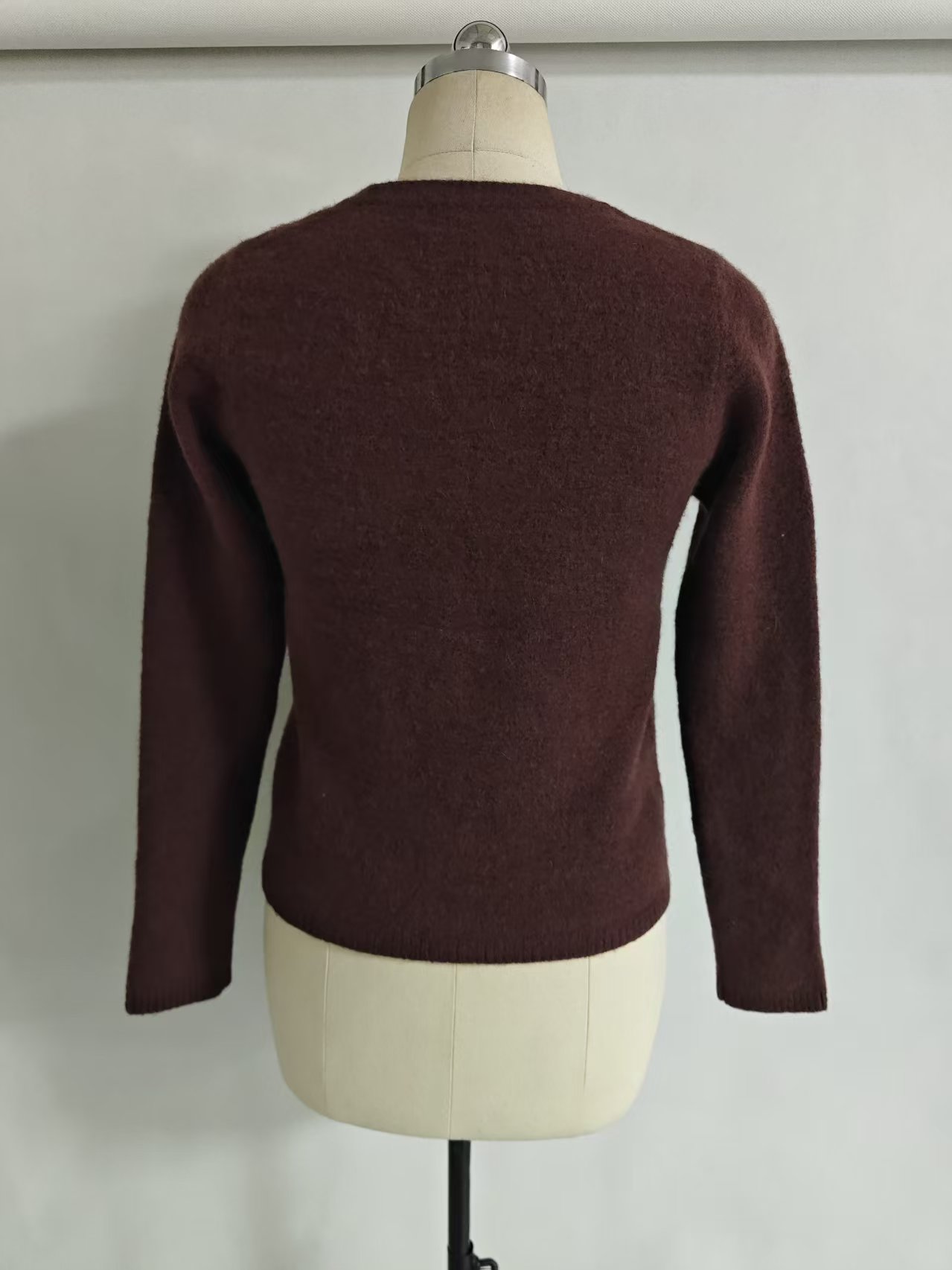 Back view of women's solid color knit cardigan TF9498