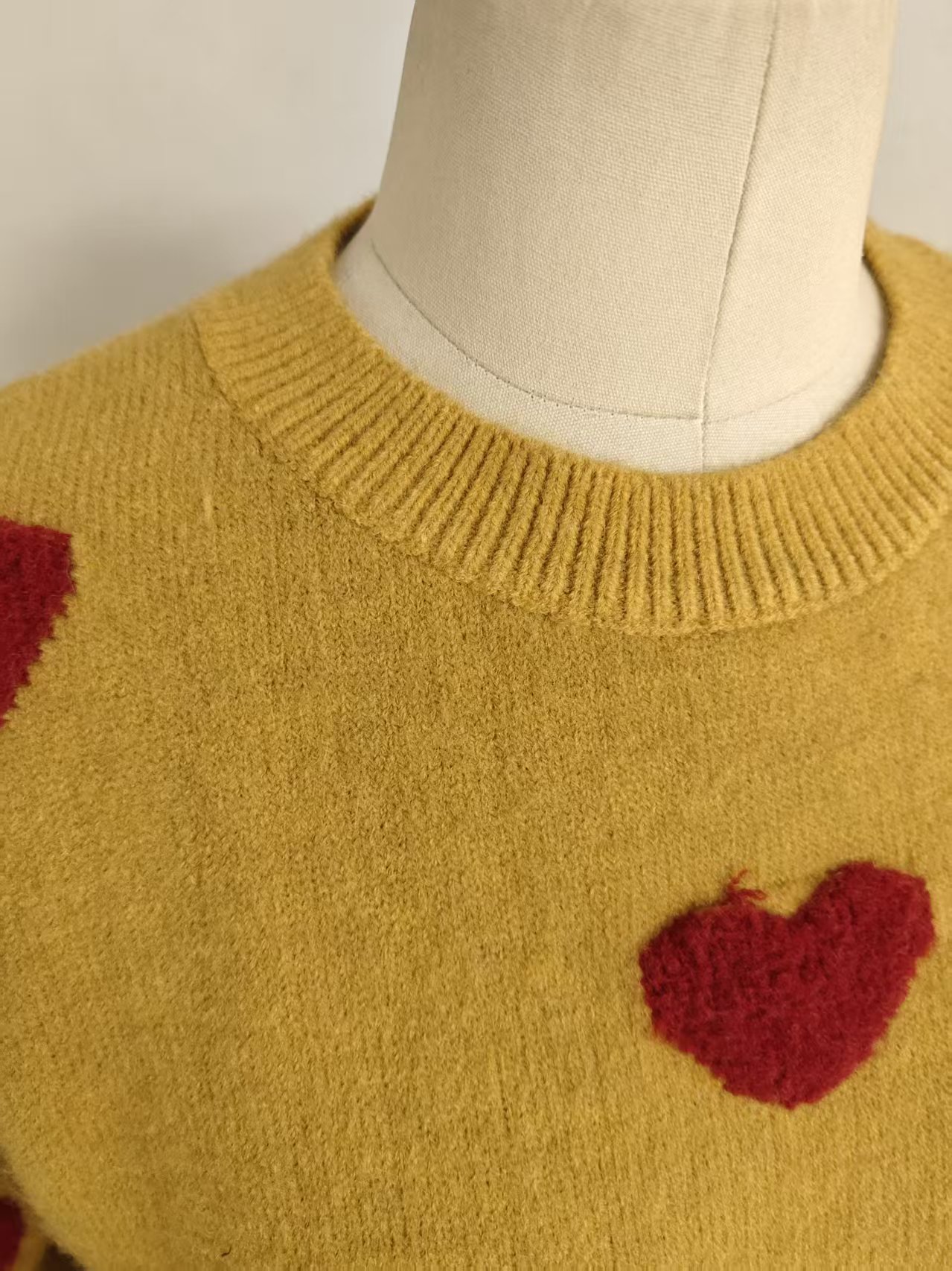 Close-up of crewneck collar and soft cotton knit fabric TF9499