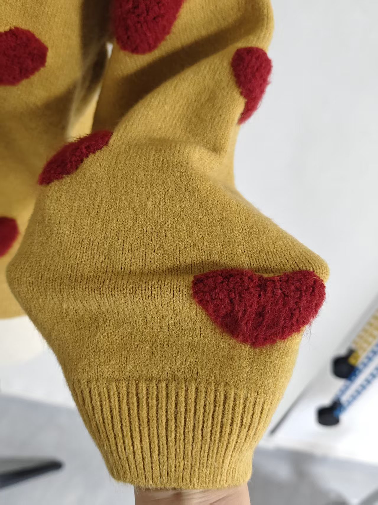 Back view of women's mustard long sleeve knit sweater TF9499
