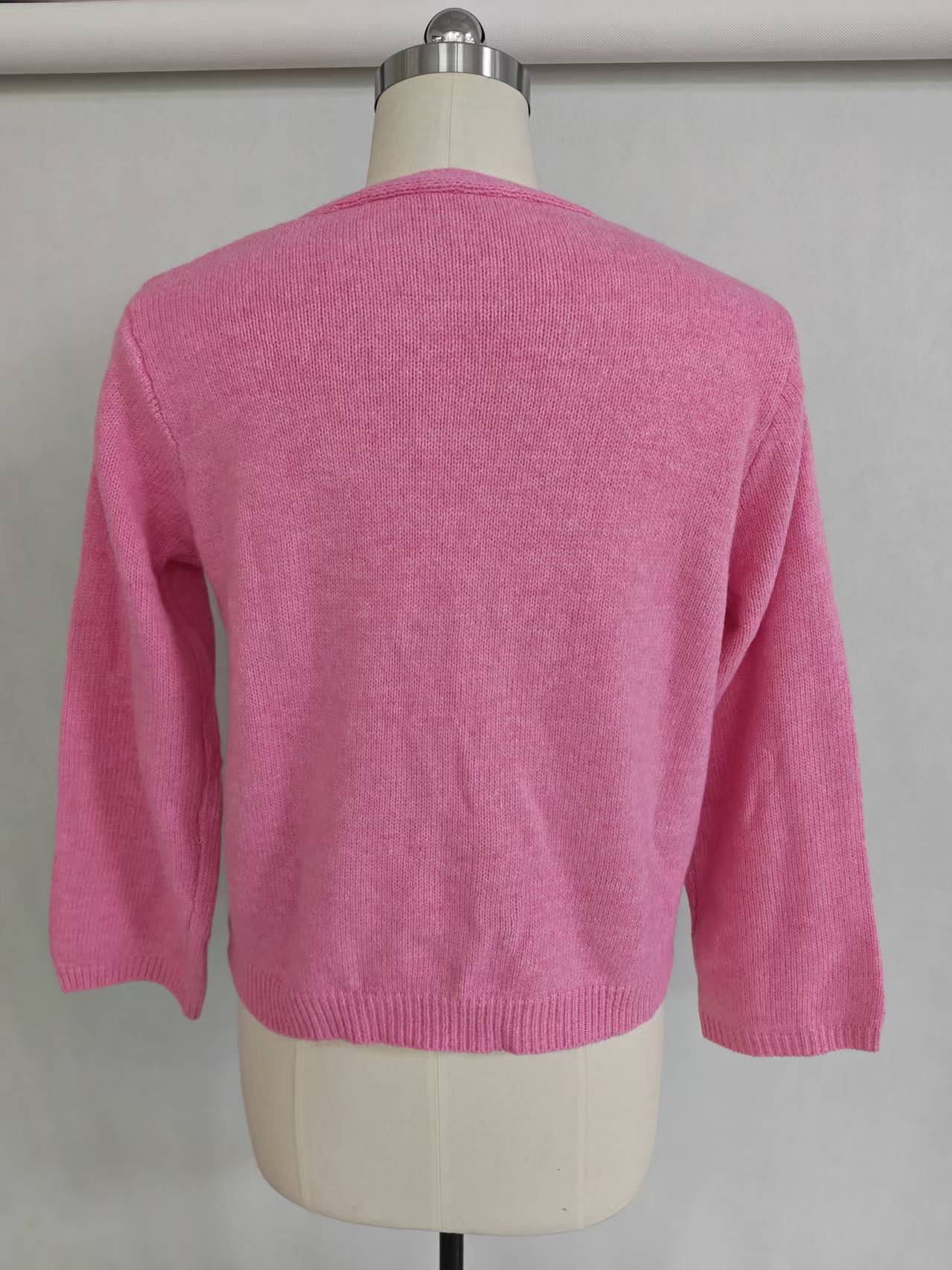 Back view of women's solid color knit cardigan TF9559