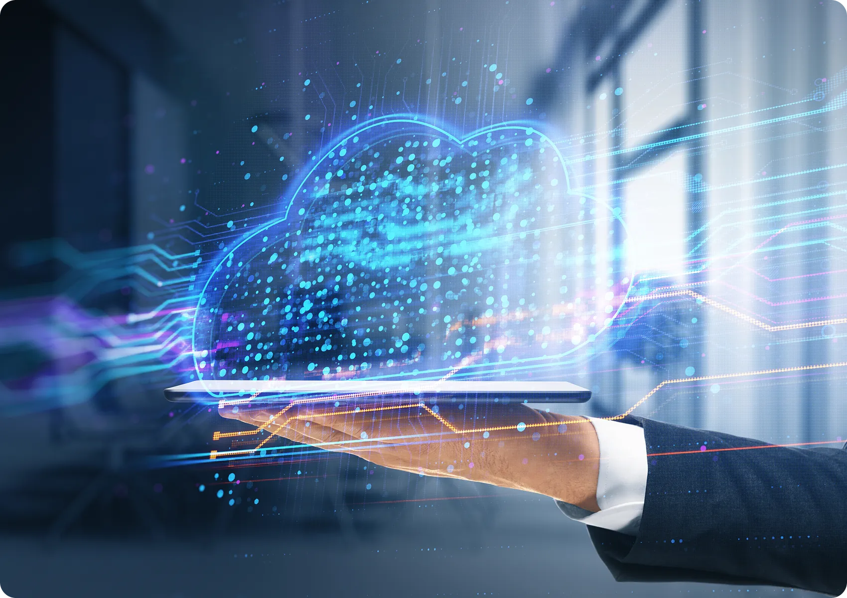Business professional holding a laptop displaying a cloud computing concept