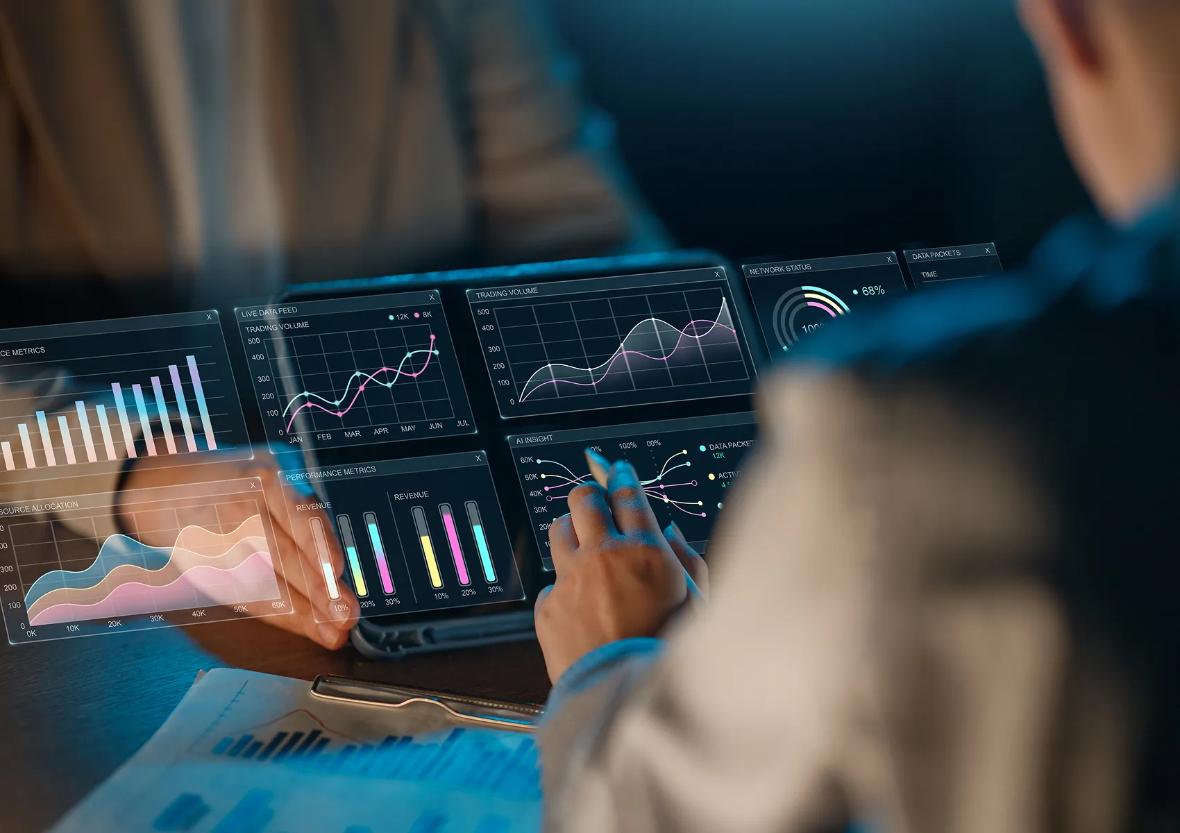 Business professional reviewing data analytics dashboards on a laptop