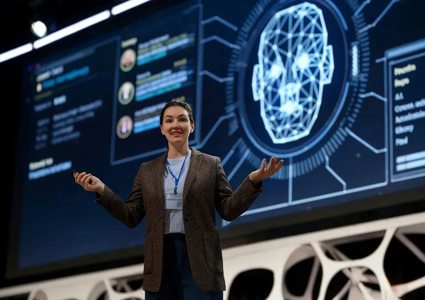 Business professional presenting AI and data insights on a large digital display