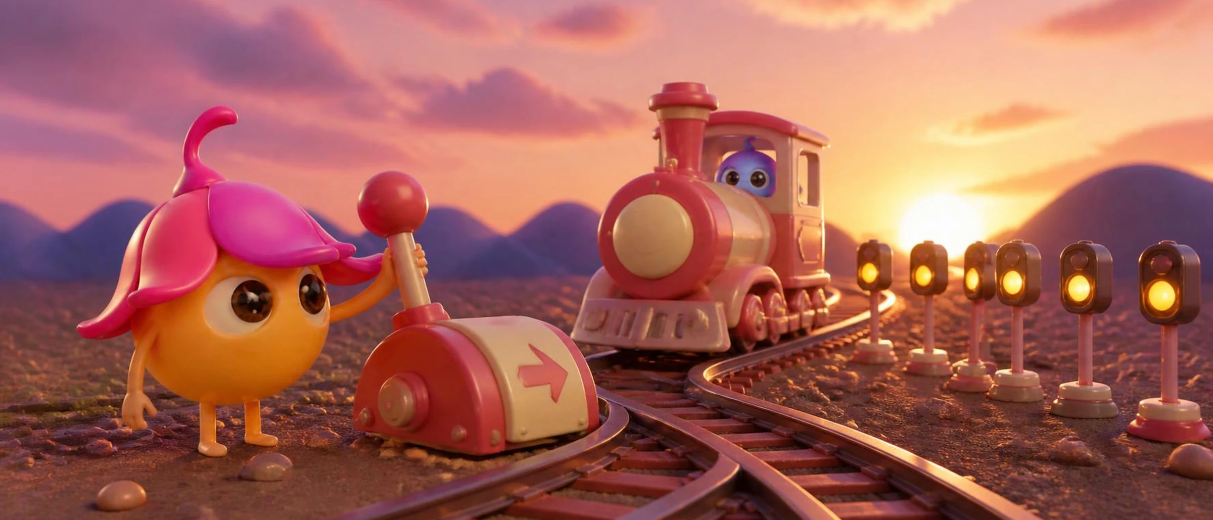 Seed, la mascotte Sinéa, actionne un aiguillage pour remettre un petit train sur la bonne voie, au coucher du soleil.