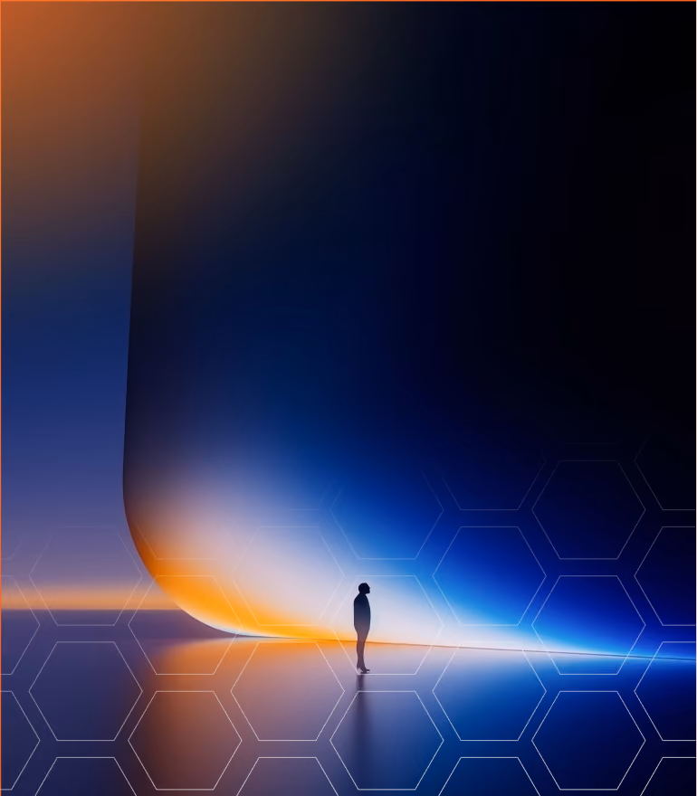 Silhouette of person standing before a giant glowing curved screen with blue and orange light.
