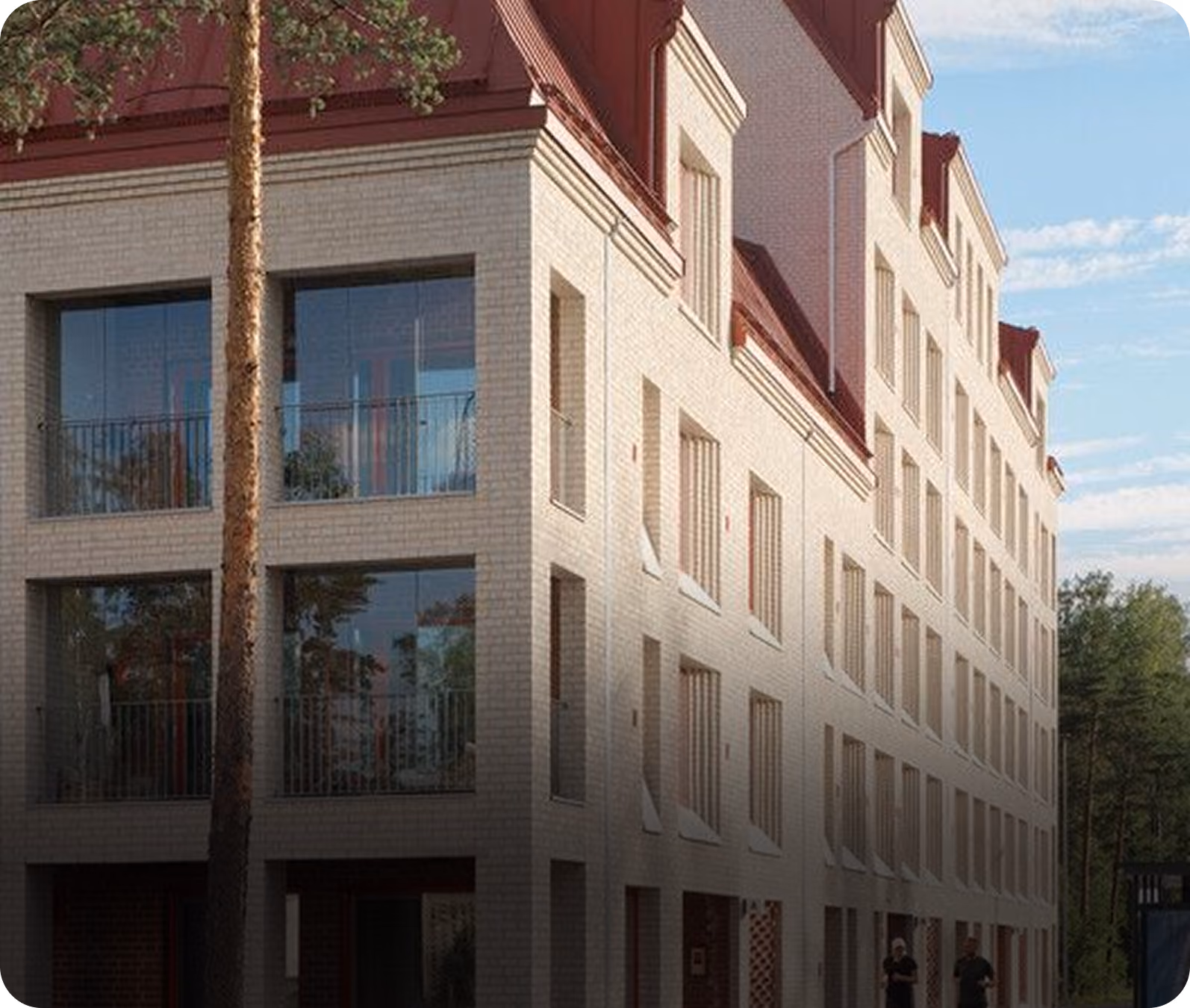 Heller Mehrfamilienhaus-Neubau mit roten Dachgauben – Schritt Inbetriebnahme