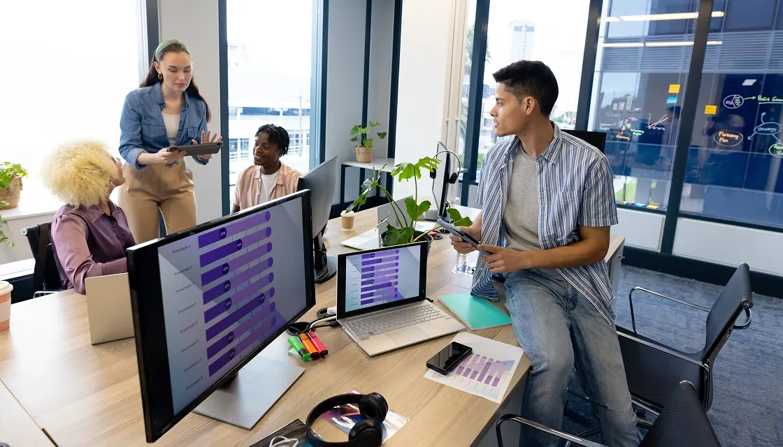 Business Team Collaborating on Project in Modern Office