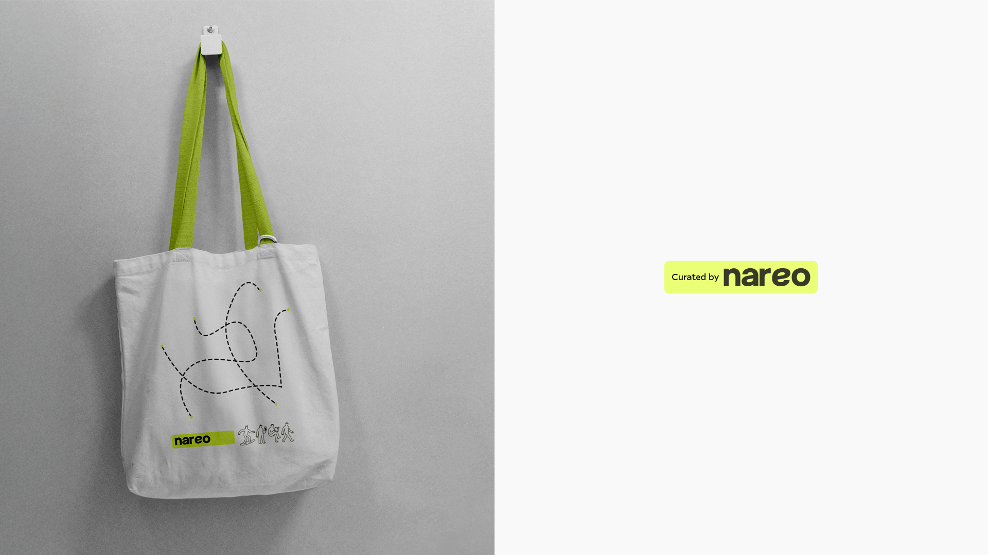 White tote bag with green handles hanging on wall, decorated with dashed lines and small human figures.