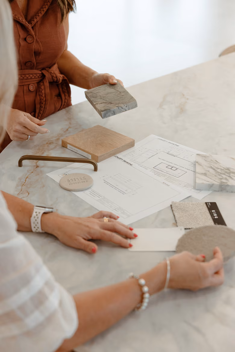 Two people looking at plans