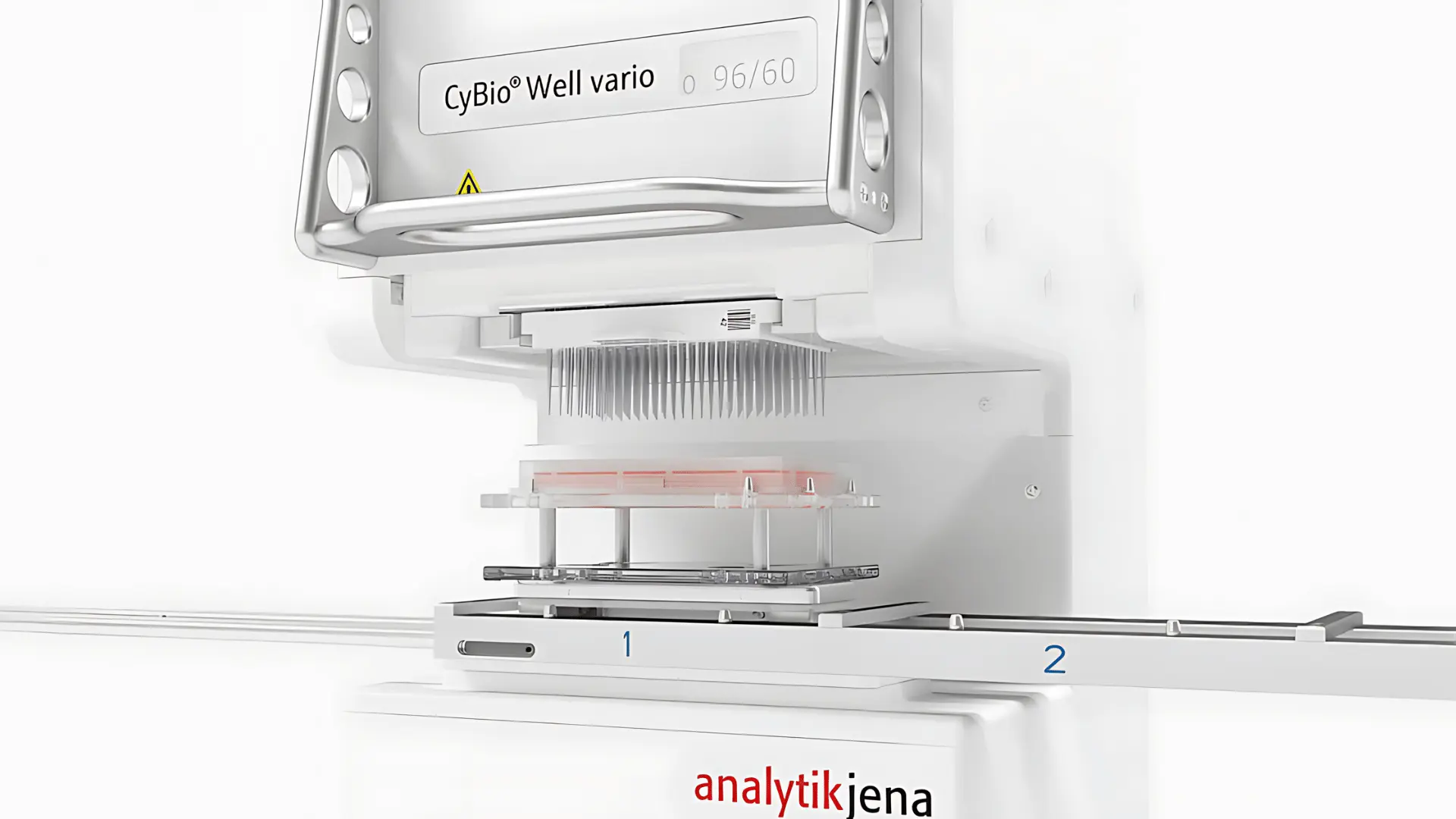 Système automatisé de pipetage multicanal CyBio Well vario d'Analytik Jena avec une plaque de puits positionnée sous plusieurs pointes de pipette métalliques.
