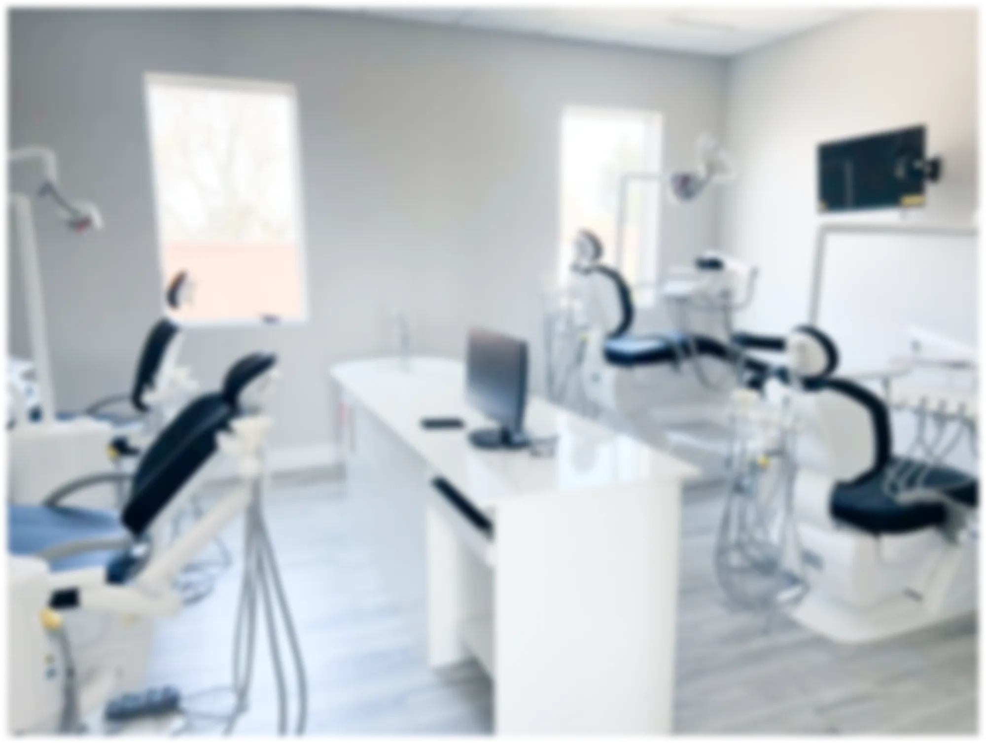 Modern dental operatory with patient chairs and workstation at MacArthur Dental Arts in Irvine, CA
