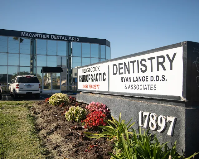 Specialist dentist examining patient at MacArthur Dental Arts