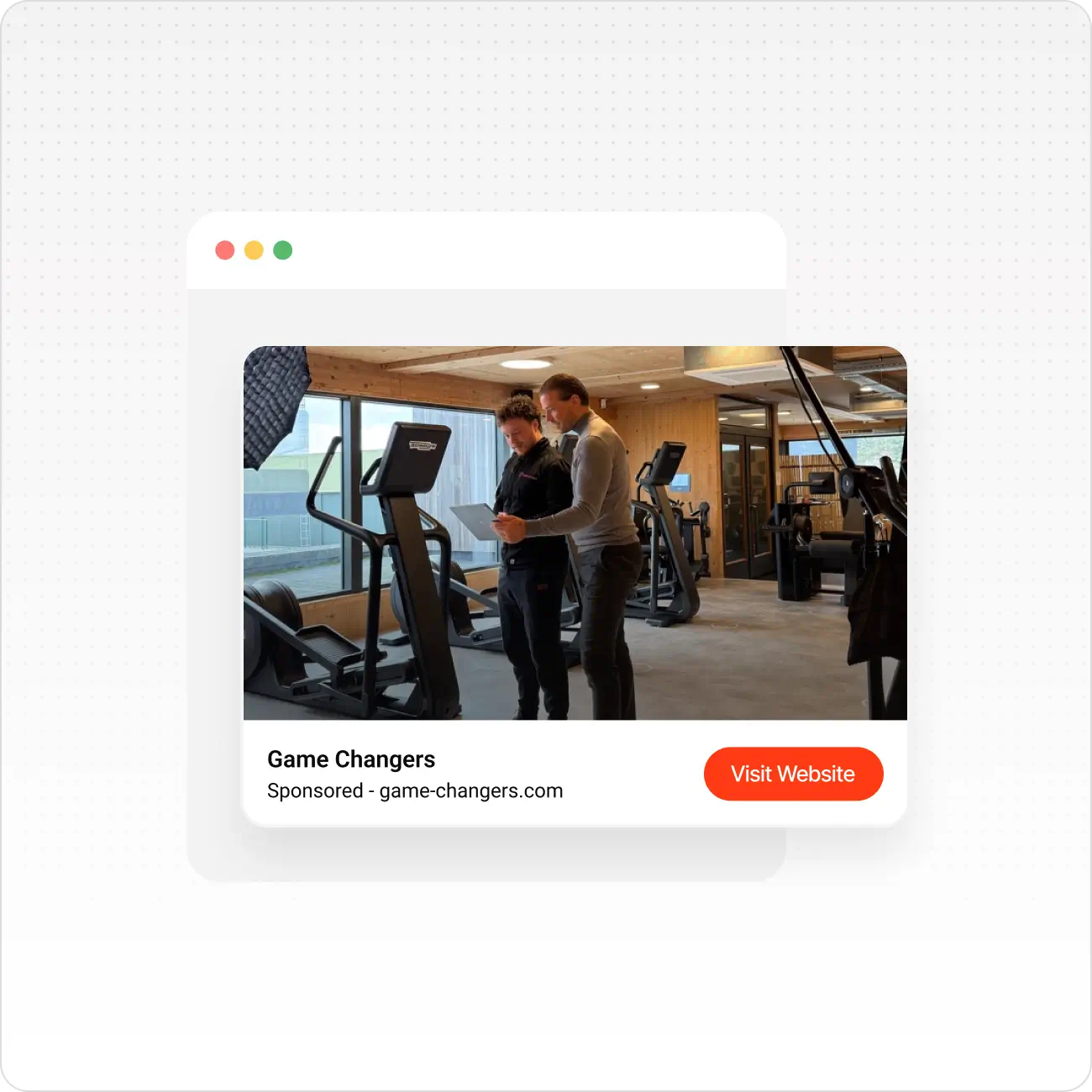 Two men reviewing notes beside gym equipment in a wooden-finished fitness centre with large windows.
