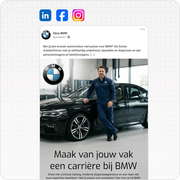 BMW mechanic in blue uniform leaning on a black BMW car inside a garage with a BMW logo above.