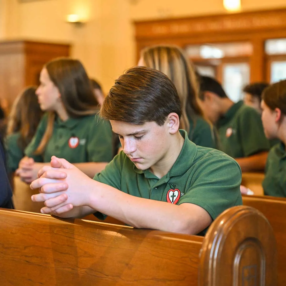 Catholic school student praying