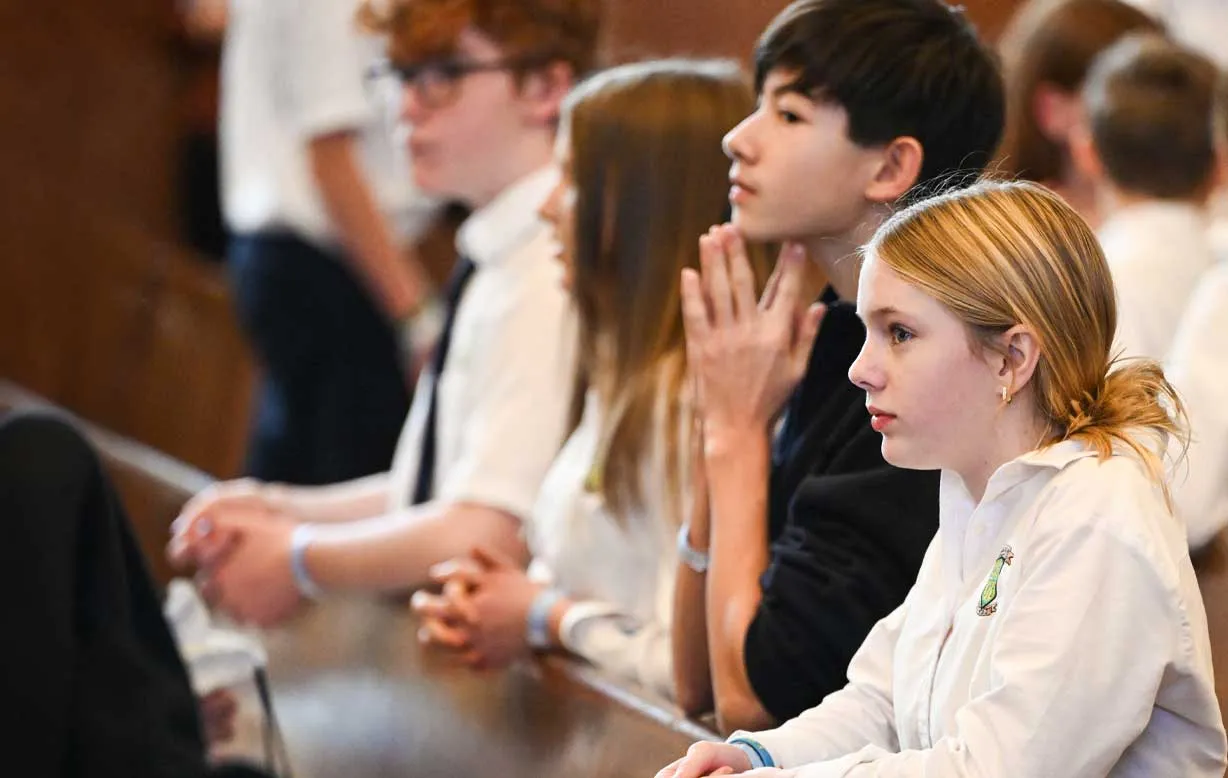 Catholic students praying together
