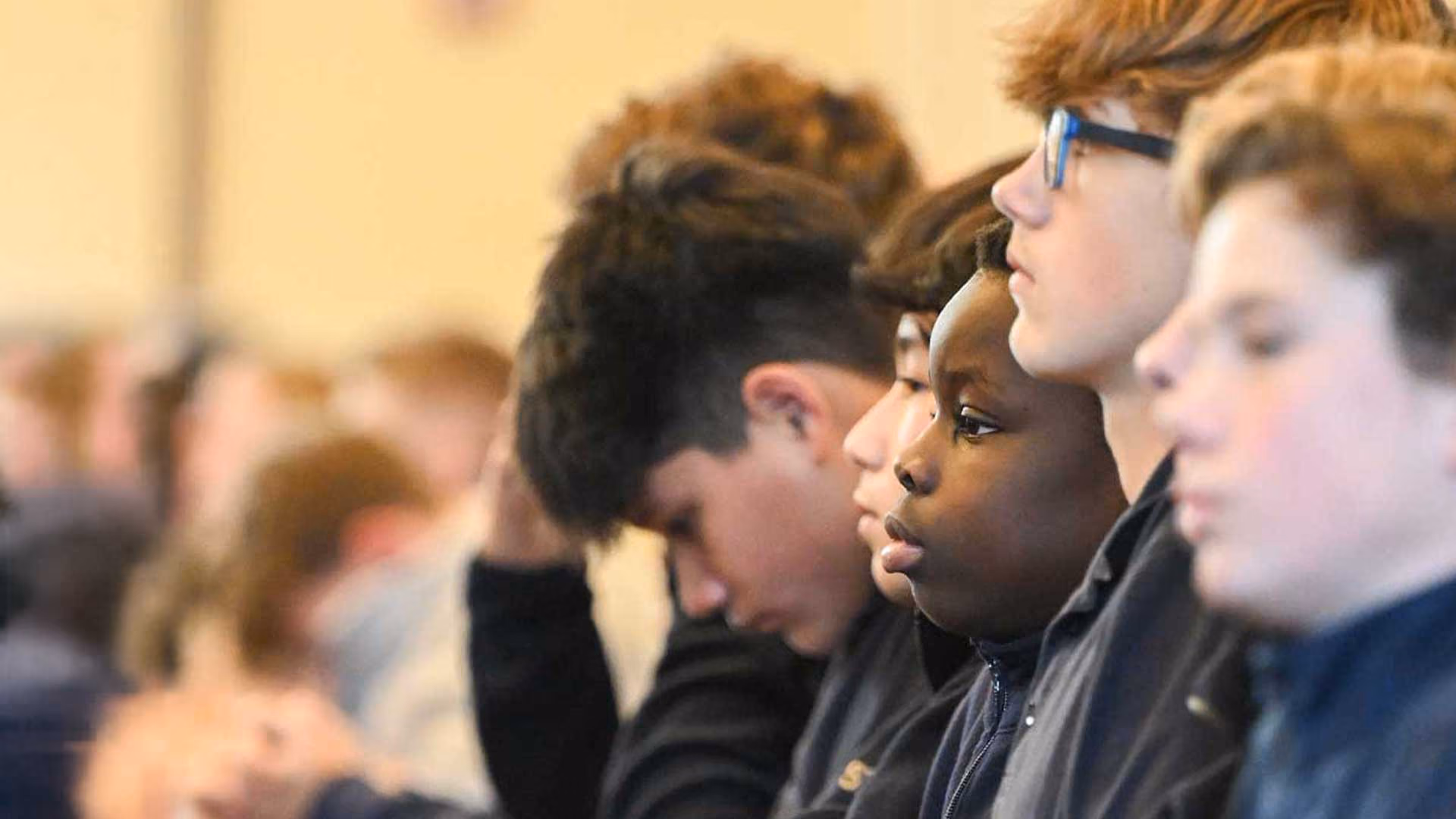 Catholic schoolchildren praying together