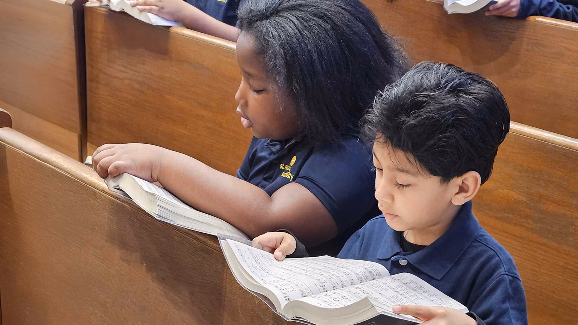 Catholic students praying together