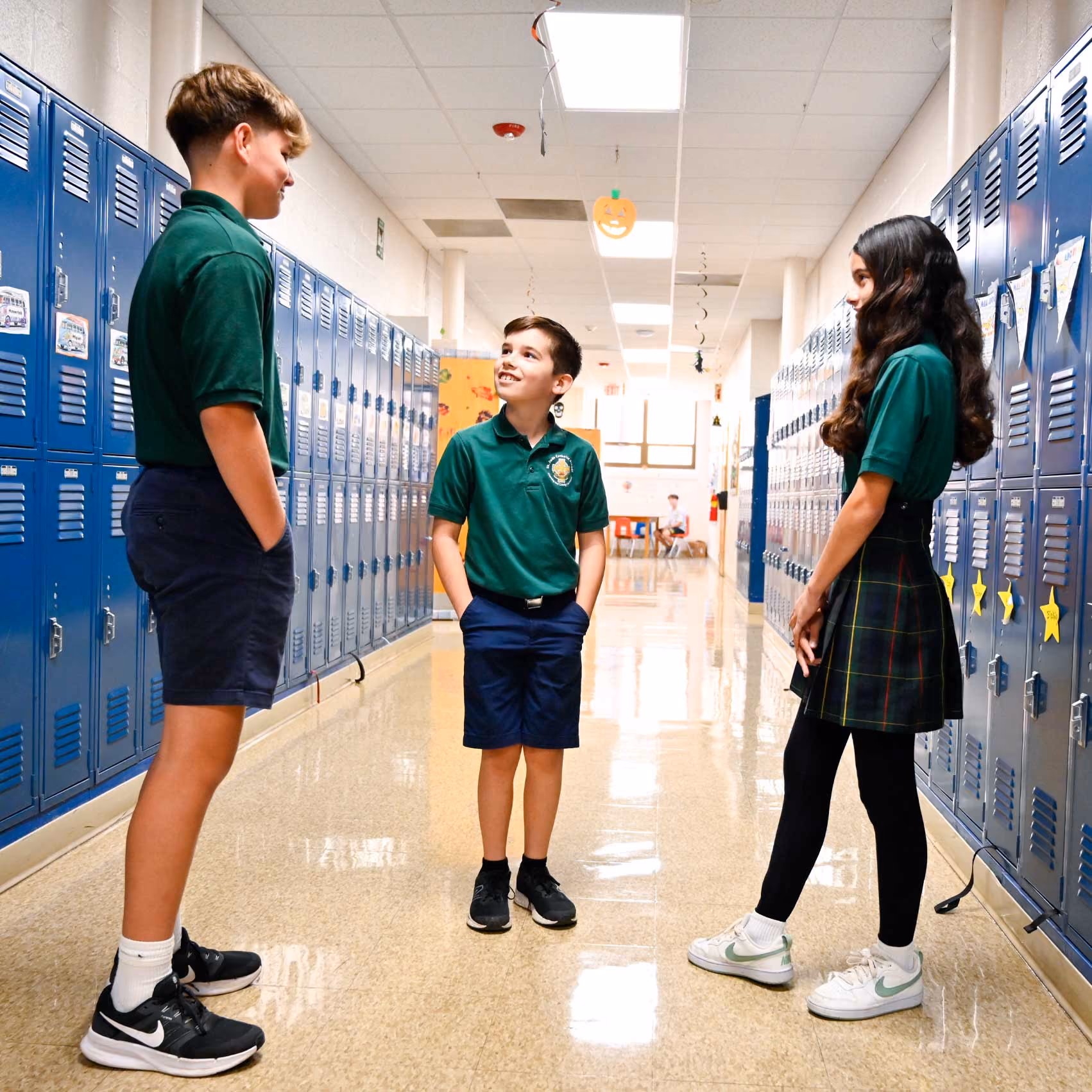 Priest greeting a Catholic school student