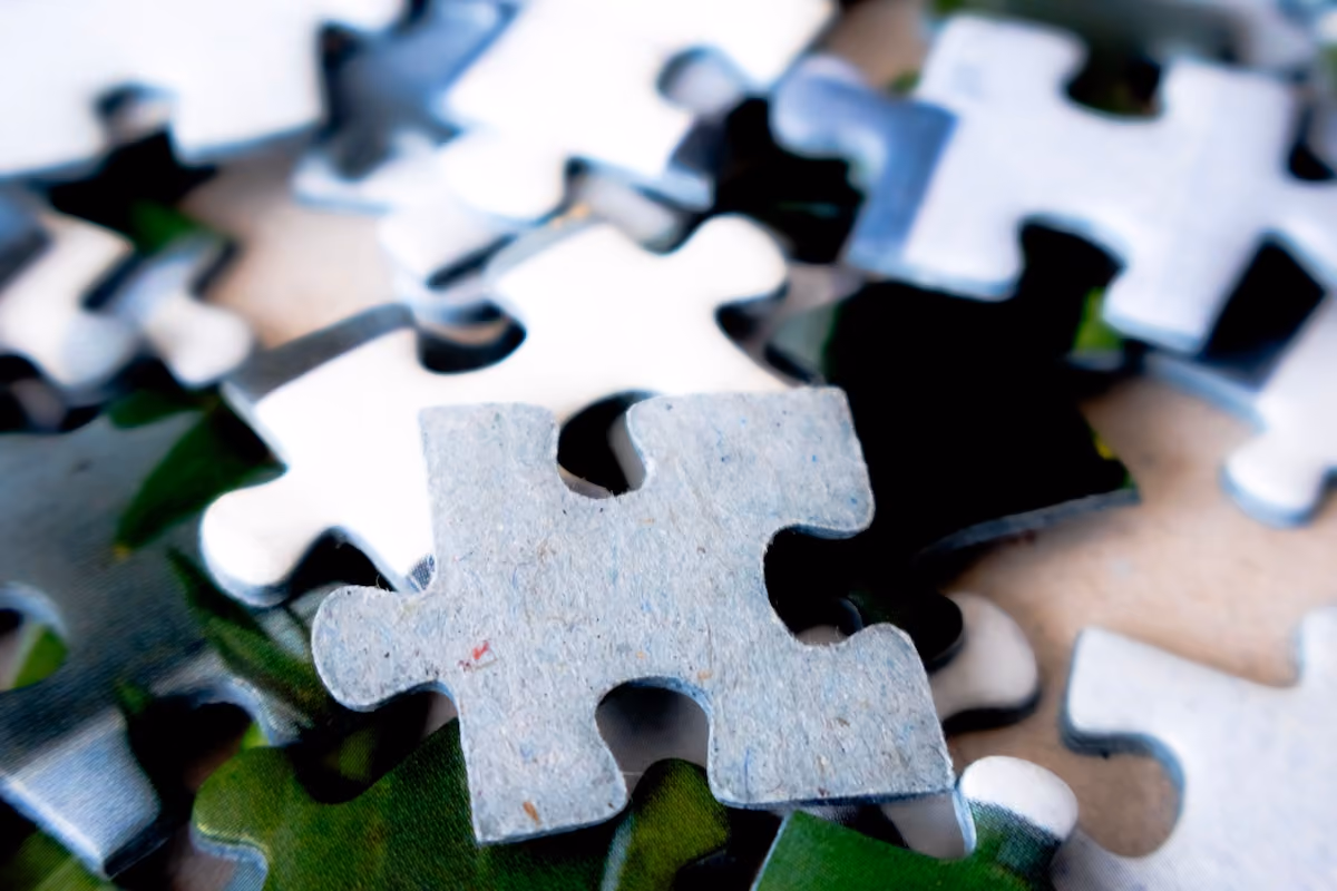 Detailed image of scattered puzzle pieces, showcasing vibrant colors and textures.