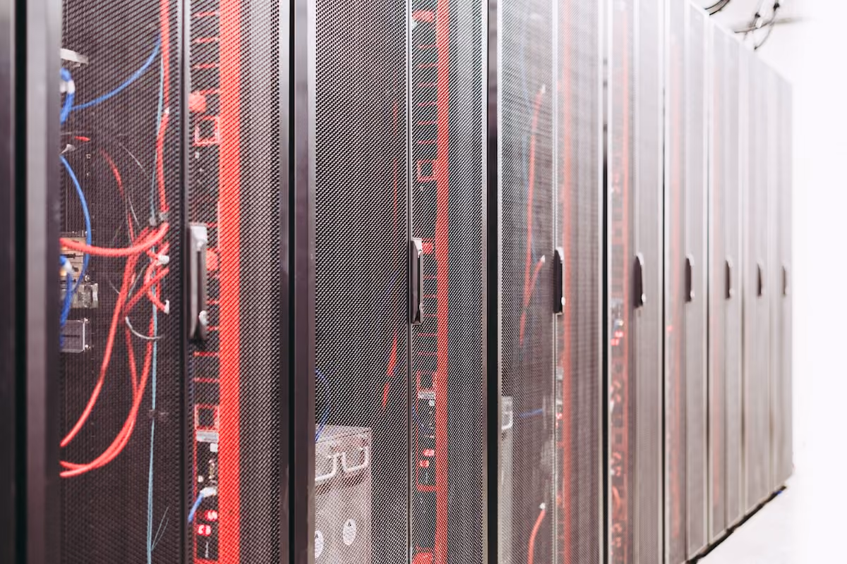 Modern data server room with network racks and cables.