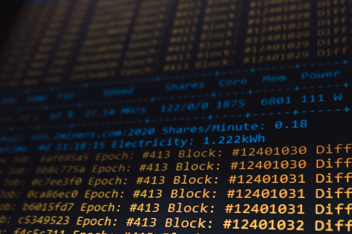 Detailed view of a cryptocurrency mining software interface displaying real-time data on a computer monitor.