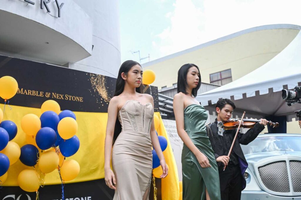 Models and a violinist performing at the Eco Marble and Nex Stone show gallery grand launch 2025